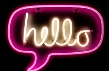 A neon sign with the word hello written in it